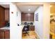 Compact home office space with built-in cabinets and wooden floors at 15484 E 115Th Ave, Commerce City, CO 80022