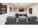 Home theater room featuring tiered seating and movie decor creating an immersive experience at 15484 E 115Th Ave, Commerce City, CO 80022