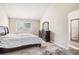 Comfortable bedroom featuring natural light, a neutral color scheme, and ample closet space at 7580 S Cove Cir, Centennial, CO 80122