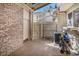 Private outdoor patio area with brick accents, perfect for relaxing or entertaining at 7580 S Cove Cir, Centennial, CO 80122