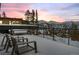 Balcony with outdoor seating and expansive mountain views at dusk at 310 N Fuller Placer Rd, Breckenridge, CO 80424