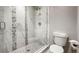 Modern bathroom with glass enclosed shower, patterned tile, and a white toilet at 310 N Fuller Placer Rd, Breckenridge, CO 80424