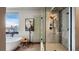 Stunning bathroom with a freestanding tub, walk-in shower, and mountain views through a large window at 310 N Fuller Placer Rd, Breckenridge, CO 80424