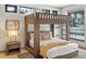 Charming bedroom with bunk beds, natural light, and cozy decor for a comfortable stay at 310 N Fuller Placer Rd, Breckenridge, CO 80424