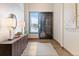Inviting entryway with stylish furnishings, a large window with a scenic view and hardwood floors at 310 N Fuller Placer Rd, Breckenridge, CO 80424