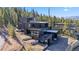 Modern home with multiple balconies and manicured landscape at 310 N Fuller Placer Rd, Breckenridge, CO 80424