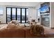 Comfortable living room features a modern fireplace and picturesque mountain views at 310 N Fuller Placer Rd, Breckenridge, CO 80424