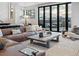 Cozy living room featuring a leather sofa, mountain views, and natural light at 310 N Fuller Placer Rd, Breckenridge, CO 80424