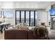 Spacious living room features a modern fireplace and gorgeous mountain view at 310 N Fuller Placer Rd, Breckenridge, CO 80424