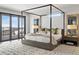 Relaxing main bedroom with canopy bed and scenic mountain views at 310 N Fuller Placer Rd, Breckenridge, CO 80424