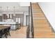Staircase leads to kitchen and dining area with modern pendant lighting at 310 N Fuller Placer Rd, Breckenridge, CO 80424