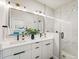 Stylish bathroom features dual sinks, modern fixtures, and a luxurious walk-in shower at 4232 Jason St # 7, Denver, CO 80211