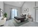 Well-lit bedroom with an open sliding door to balcony, neutral tones, vaulted ceiling and plush carpet at 4232 Jason St # 7, Denver, CO 80211