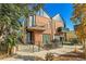 Contemporary townhome exterior with brick facade, balconies, modern railing and professional landscaping at 4232 Jason St # 7, Denver, CO 80211