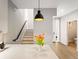 The kitchen has an island with a quartz countertop that is the central feature of the space at 4232 Jason St # 7, Denver, CO 80211