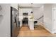 Well-equipped kitchen with stainless steel appliances and breakfast bar seamlessly blends form and function at 4232 Jason St # 7, Denver, CO 80211