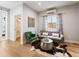 Charming living room is adjacent to an entry door and also has a small powder room at 4232 Jason St # 7, Denver, CO 80211