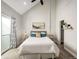 Vaulted main bedroom with a patio provides a light-filled and cozy retreat at 4232 Jason St # 7, Denver, CO 80211