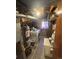 A basement laundry area featuring concrete floors, washer, dryer, and utility features at 1419 S Terry St, Longmont, CO 80501