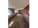 A basement featuring wood paneling, carpet, and a fireplace at 1419 S Terry St, Longmont, CO 80501