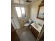 A well-lit bathroom features a single sink vanity and neutral finishes at 1419 S Terry St, Longmont, CO 80501