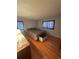 Hardwood floors and natural light from two windows brighten this cozy bedroom at 1419 S Terry St, Longmont, CO 80501