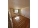 A bedroom featuring wood floors and a small window at 1419 S Terry St, Longmont, CO 80501