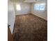 A bedroom featuring brown carpet and two windows at 1419 S Terry St, Longmont, CO 80501