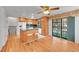 Spacious kitchen with an island, stainless steel appliances, and a ceiling fan at 2826 S Lamar St, Denver, CO 80227