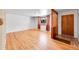 Bright living room with hardwood floors and a large window at 2826 S Lamar St, Denver, CO 80227