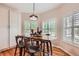 Cozy dining area with hardwood floors, natural light, and stylish furnishings at 21107 Hawthorne Ln, Parker, CO 80138