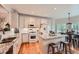 Bright, modern kitchen with granite countertops, stainless steel appliances, and a breakfast bar at 21107 Hawthorne Ln, Parker, CO 80138