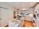 Bright, modern kitchen with granite countertops, stainless steel appliances, and an island at 21107 Hawthorne Ln, Parker, CO 80138