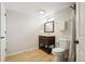 Basement bathroom with dark vanity, tile floors, and a shower/tub combination at 3285 S Delaware St, Englewood, CO 80110