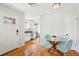 View of dining table and chairs with kitchen in the background at 3285 S Delaware St, Englewood, CO 80110