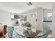 Well-lit living area with hardwood floors and a view of the kitchen at 3285 S Delaware St, Englewood, CO 80110