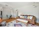 Living room with a patterned rug, sofa, and a dining table at 3285 S Delaware St, Englewood, CO 80110