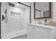 Modern bathroom features a glass shower with a rainfall shower head and a vanity sink at 5853 S Havana Ct, Englewood, CO 80111