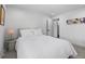 Bright bedroom with a luxurious bed, stylish decor, and an ensuite bathroom at 5853 S Havana Ct, Englewood, CO 80111