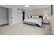 The main bedroom features carpet floors, barn door, and stylish decor at 5853 S Havana Ct, Englewood, CO 80111