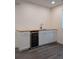 Charming bar area with a sink, cabinetry, counter space and a wine cooler at 13788 Umatilla Ln, Broomfield, CO 80023