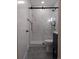 Elegant bathroom featuring a glass shower door and black fixtures at 13788 Umatilla Ln, Broomfield, CO 80023