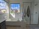 Bright bathroom with a soaking tub and a separate glass enclosed shower stall at 13788 Umatilla Ln, Broomfield, CO 80023