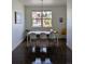 Bright dining room with modern table, pendant lighting, and large window at 13788 Umatilla Ln, Broomfield, CO 80023