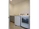 Functional laundry room featuring a modern washer, dryer and utility sink at 13788 Umatilla Ln, Broomfield, CO 80023