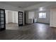Spacious living room with a bar area and French doors leading to an exercise room at 13788 Umatilla Ln, Broomfield, CO 80023