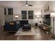 Stylish living room with plush seating, a modern rug, and warm, inviting lighting at 13788 Umatilla Ln, Broomfield, CO 80023