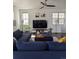 Comfortable living room with dark wood flooring, ceiling fan, and lots of natural light at 13788 Umatilla Ln, Broomfield, CO 80023