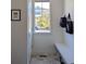 Clean mudroom with bench, hooks, and storage space; bright natural light at 13788 Umatilla Ln, Broomfield, CO 80023