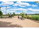 Playground equipment sits near trees and picnic tables at 13788 Umatilla Ln, Broomfield, CO 80023